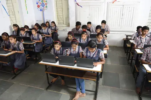 Students at a government school work on individual laptops, in Ahmedabad, India, on July 26, 2018. 